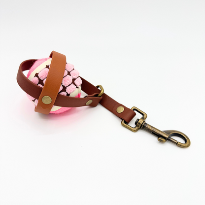 Brown Ball holder with pink ball inside